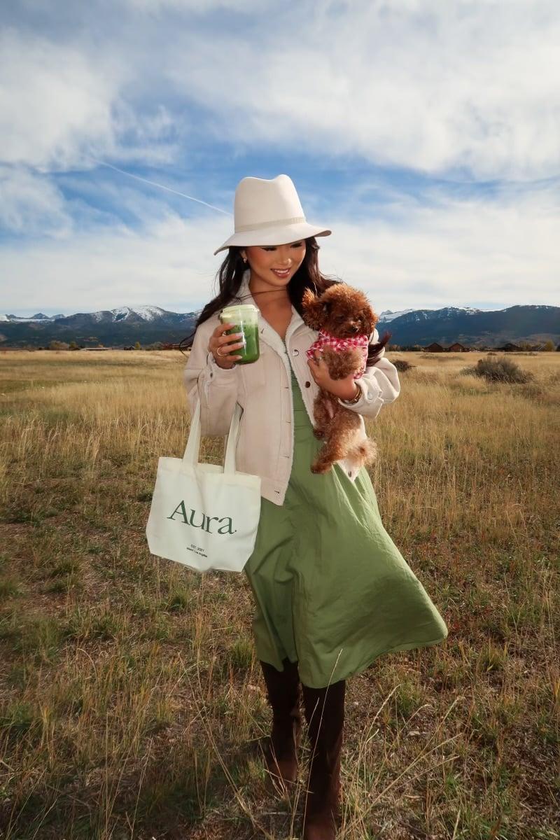 Green smoothie with mountain landscape